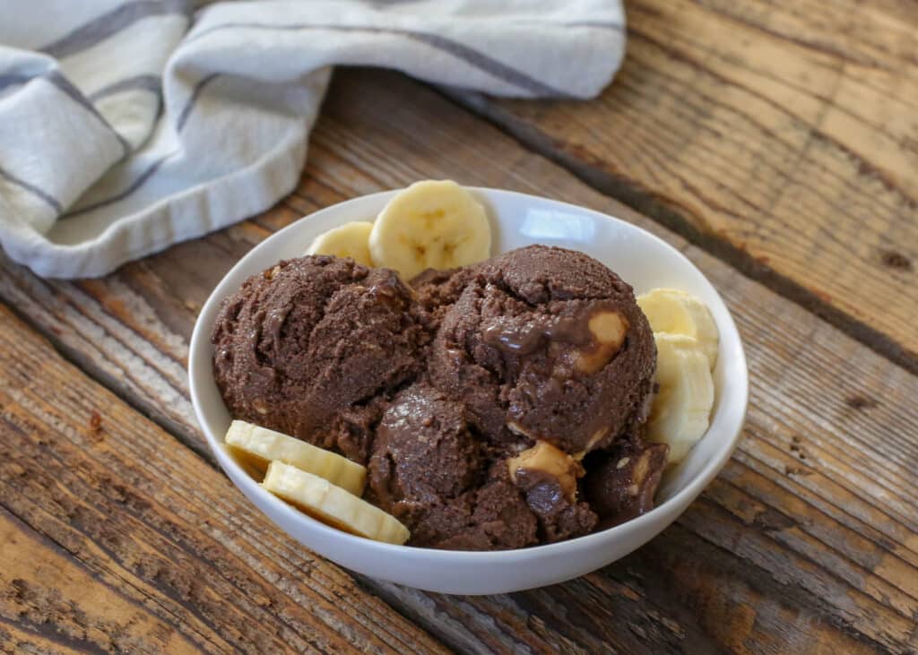 Creamy Chocolate and Peanut Butter Chunk Ice Cream is accidentally vegan! - get the recipe at barefeetinthekitchen.com 
