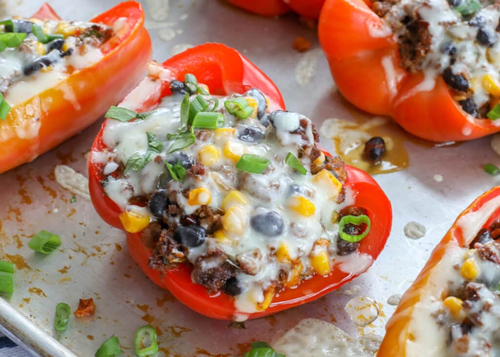 Mexican Stuffed Peppers with spicy beef, black beans, and corn are a hit!