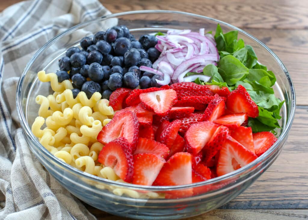 Strawberry Spinach Pasta Salad is the perfect potluck side dish.