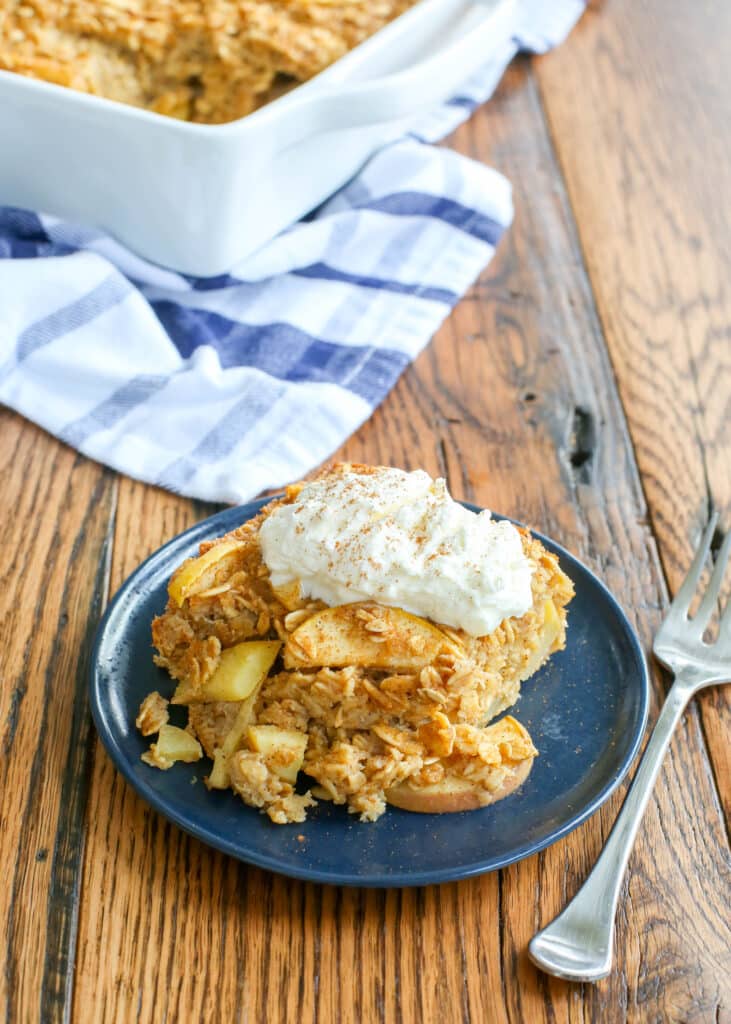 Apple Pie Baked Oatmeal with fresh whipped cream is irresistible! get the recipe at barefeetinthekitchen.com