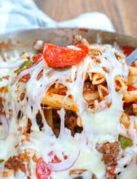 Cheesy Pizza Pasta Bake with pepperoni, sausage, peppers, mushrooms, and onions has our favorite supreme pizza flavors in an awesome bowl of pasta!