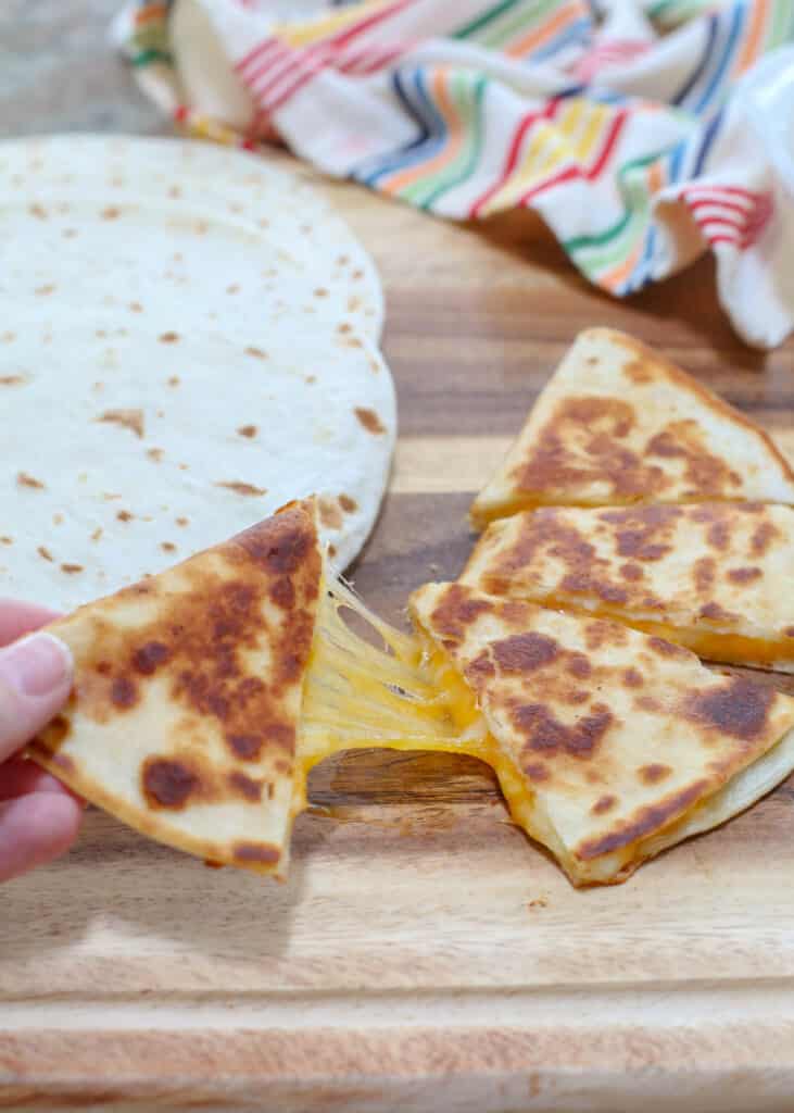 Quesadillas are a cheese filled favorite with everyone! find out how we make them at barefeetinthekitchen.com