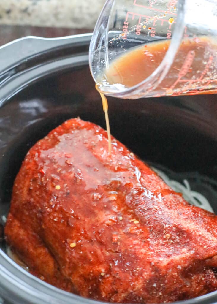 Brown Sugar, plenty of spices, and apple cider vinegar work together to create the perfect slow cooker pulled pork.