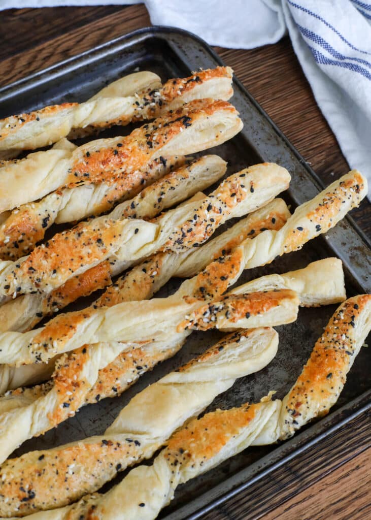 Everything Bagel Cheese Straws are easily made with puff pastry. Get the recipe at barefeetinthekitchen.com