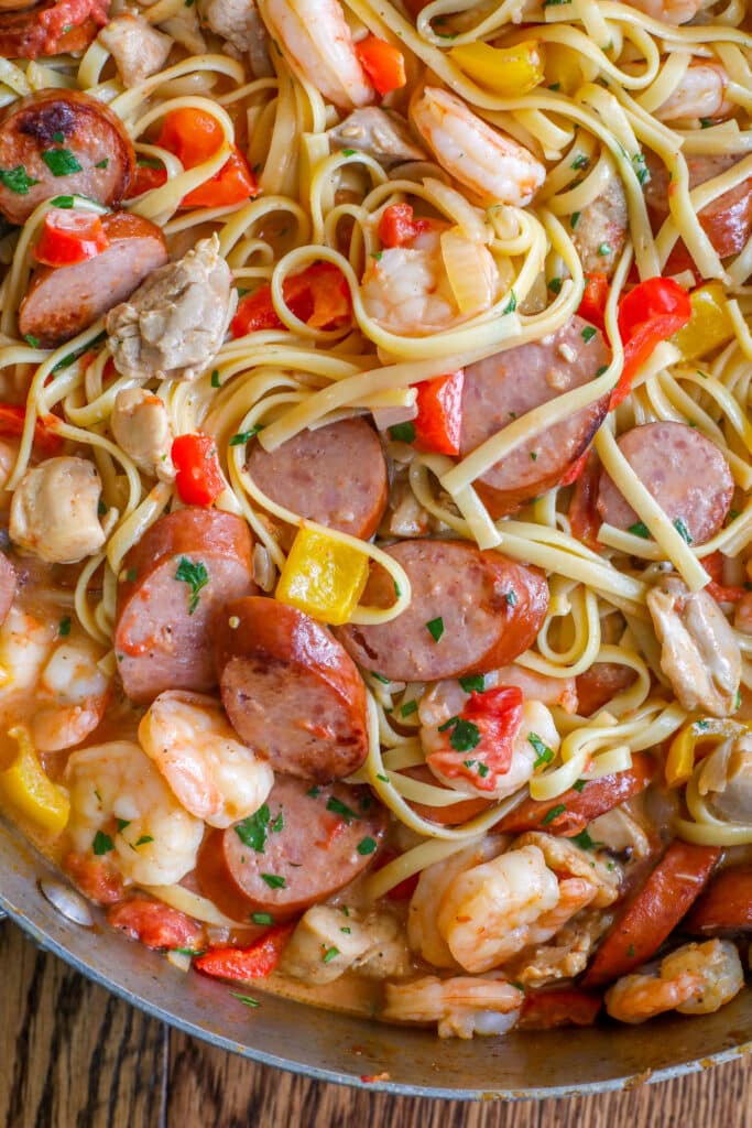 Jambalaya Pasta is fully loaded with bites of shrimp, sausage, and chicken! get the recipe at barefeetinthekitchen.com