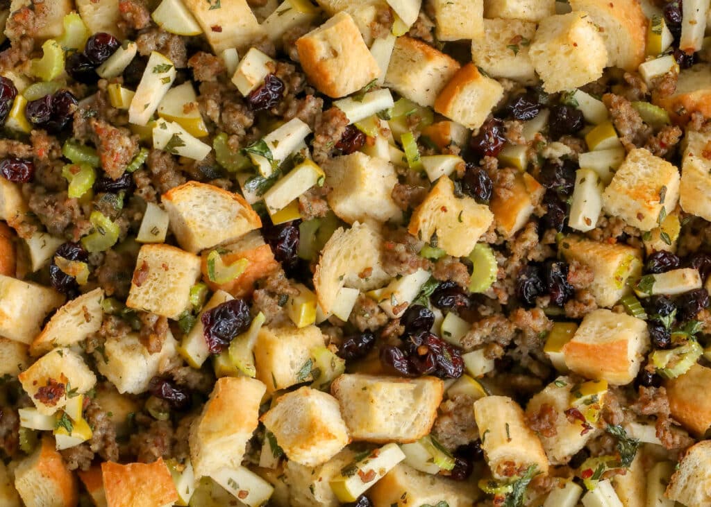Sausage stuffing recipe with herbs, apples, and cranberries