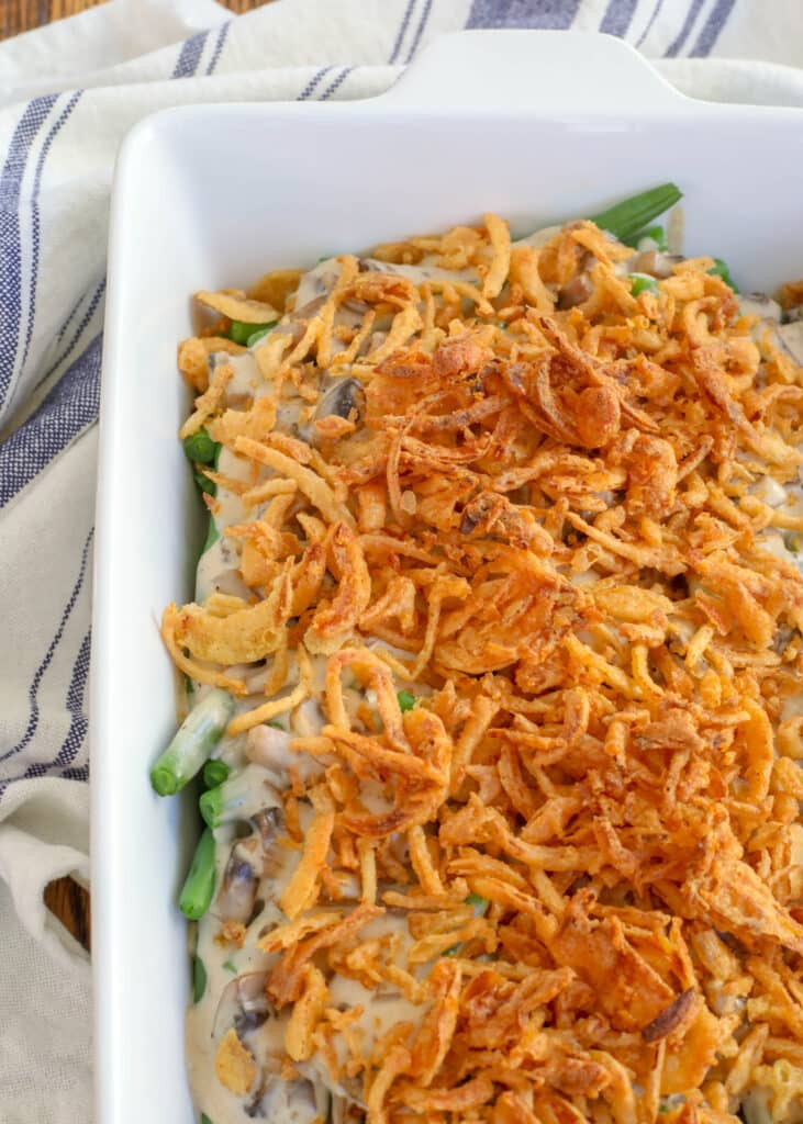 French onions have been scattered on a freshly baked fresh green bean casserole