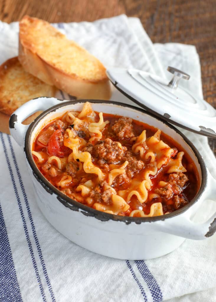 Lasagna Soup is filled with hearty chunks of beef, sausage, and tender noodles in a rich Italian spiced broth. Get the recipe at barefeetinthekitchen.com