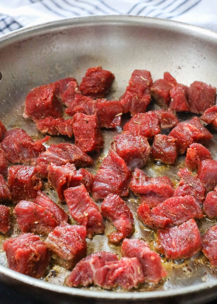 steak bites in stainless pan