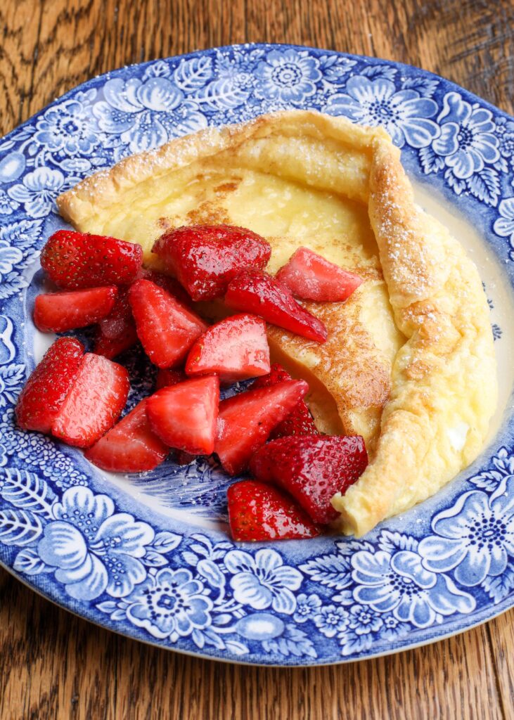German pancakes on a plate with berries