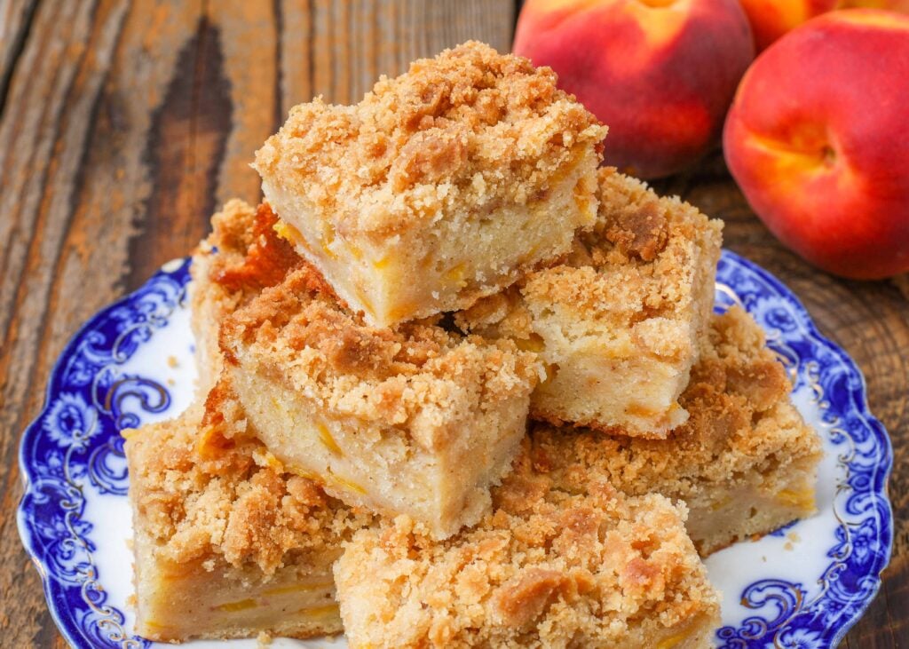 coffee cake on blue plate with peaches