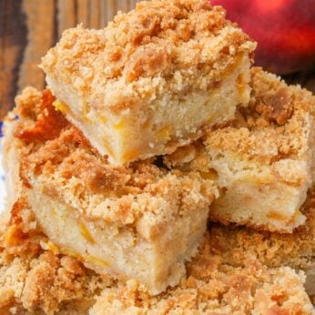 coffee cake stacked on plate with peaches