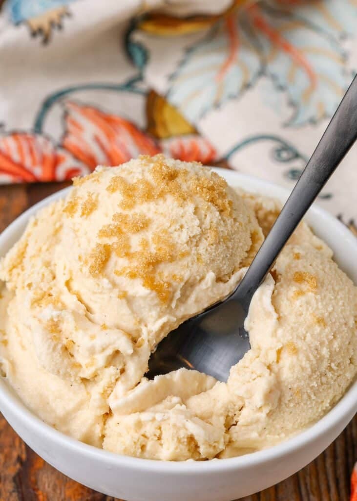 brown sugar ice cream with spoon in white bowl
