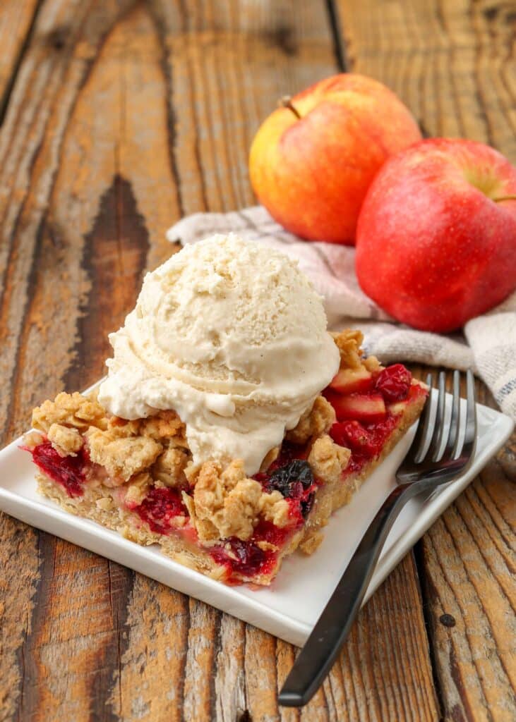 Cranberry oatmeal bars with ice cream on top