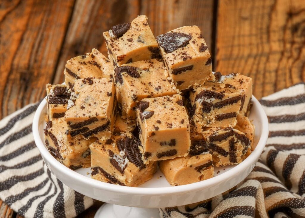 peanut butter fudge with Oreos on small white stand