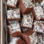 easy coconut fudge in metal pan with parchment