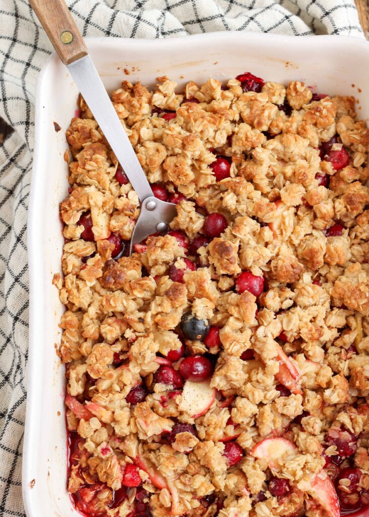 Cranberry crisp apples and a large serving spoon