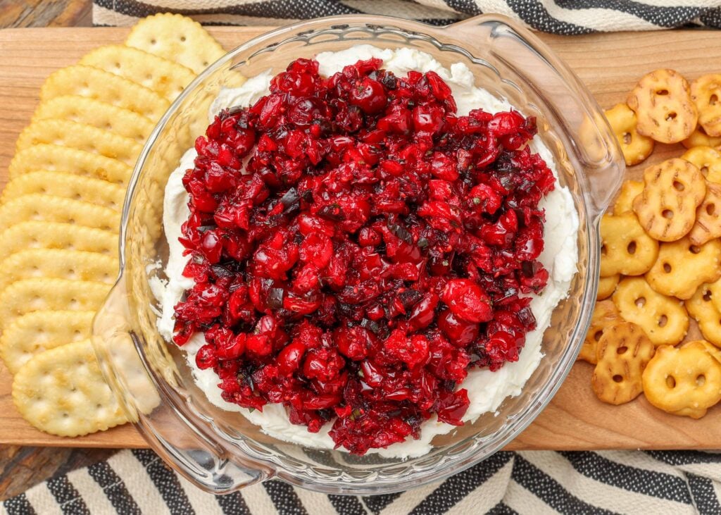 cranberry jalapeno mixture over cream cheese with crackers