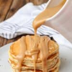 creamy peanut butter syrup pour shot over pancakes