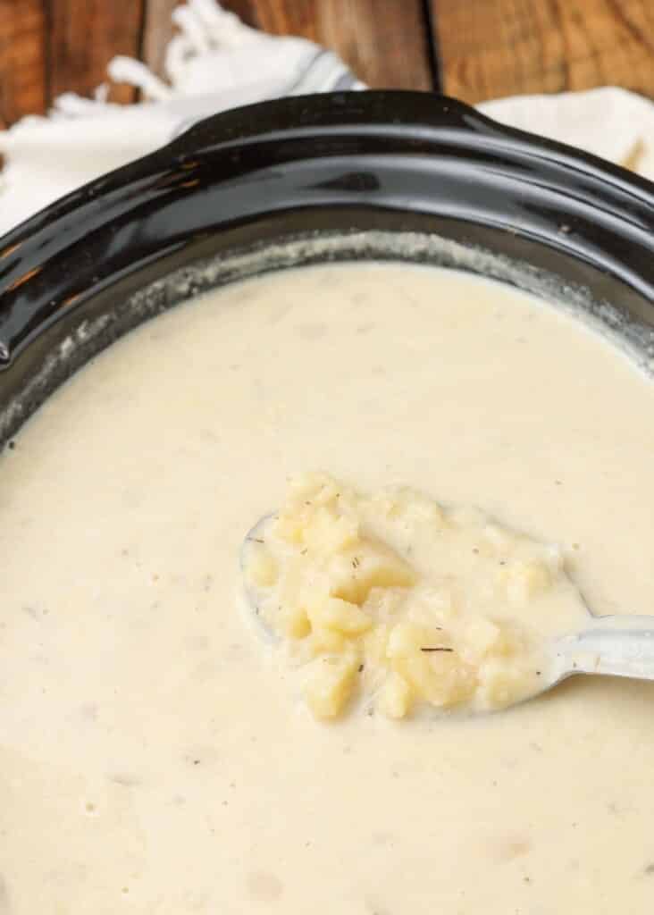potato soup in the crockpot with ladle
