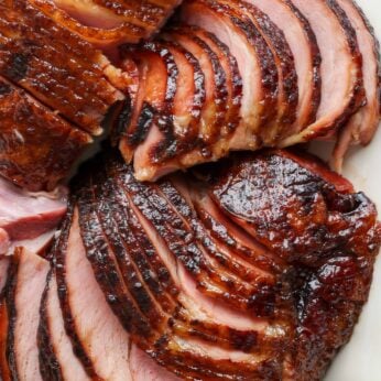 close up of sliced ham on plater