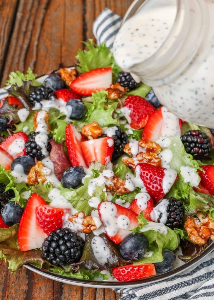 Berry salad with poppy seed dressing on large platter