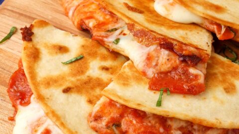 Pizza Quesadillas Quartered on Cutting Board