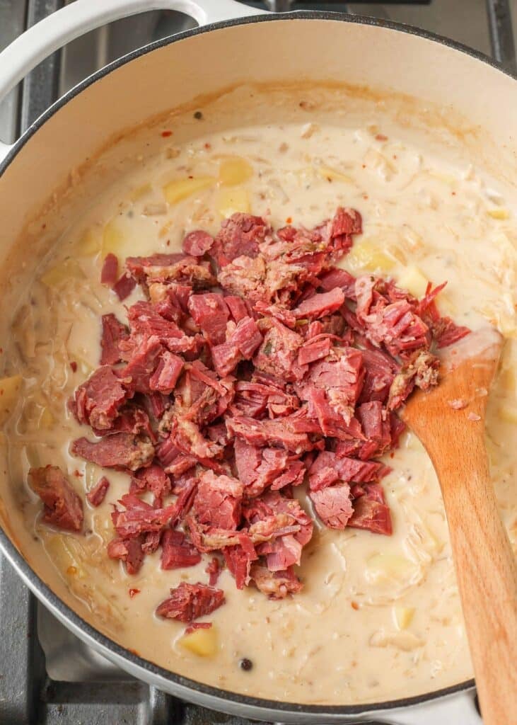creamy soup with corned beef, sauerkraut, and potatoes