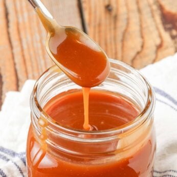 spoon over jar with caramel sauce