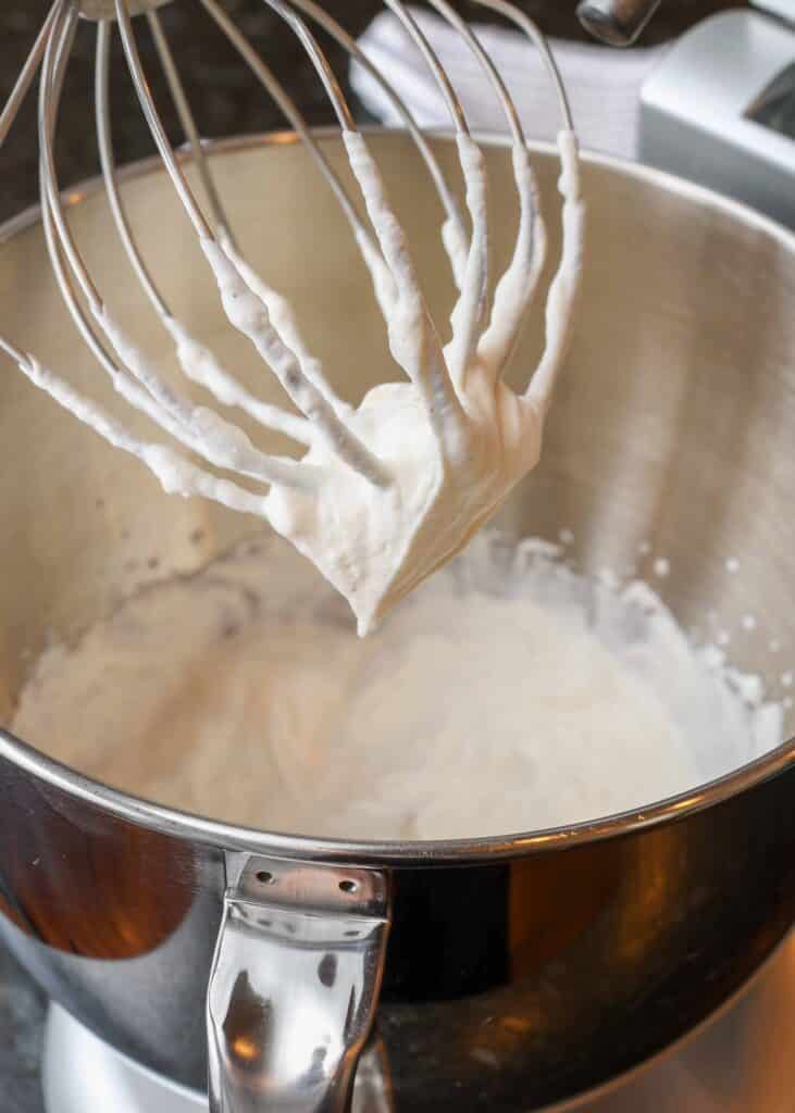whipped cream in mixing bowl with whisk