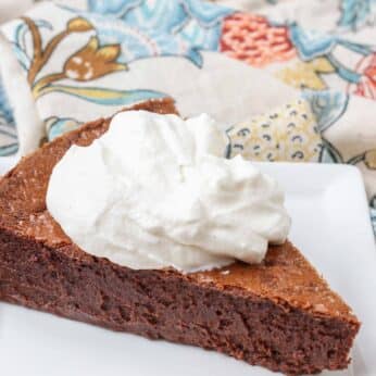 chocolate cake with whip cream dollop