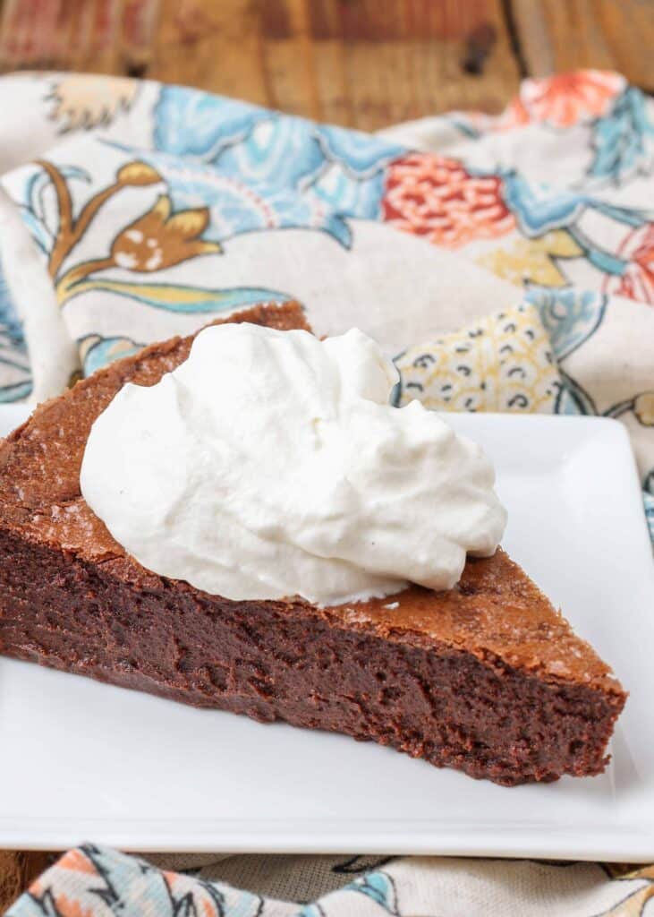 chocolate cake with whip cream dollop
