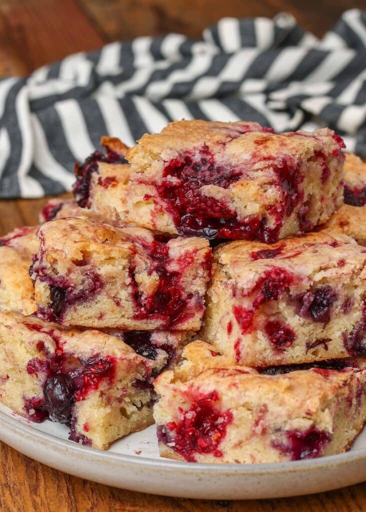 Berry Cake squares with a blue and white striped napkin