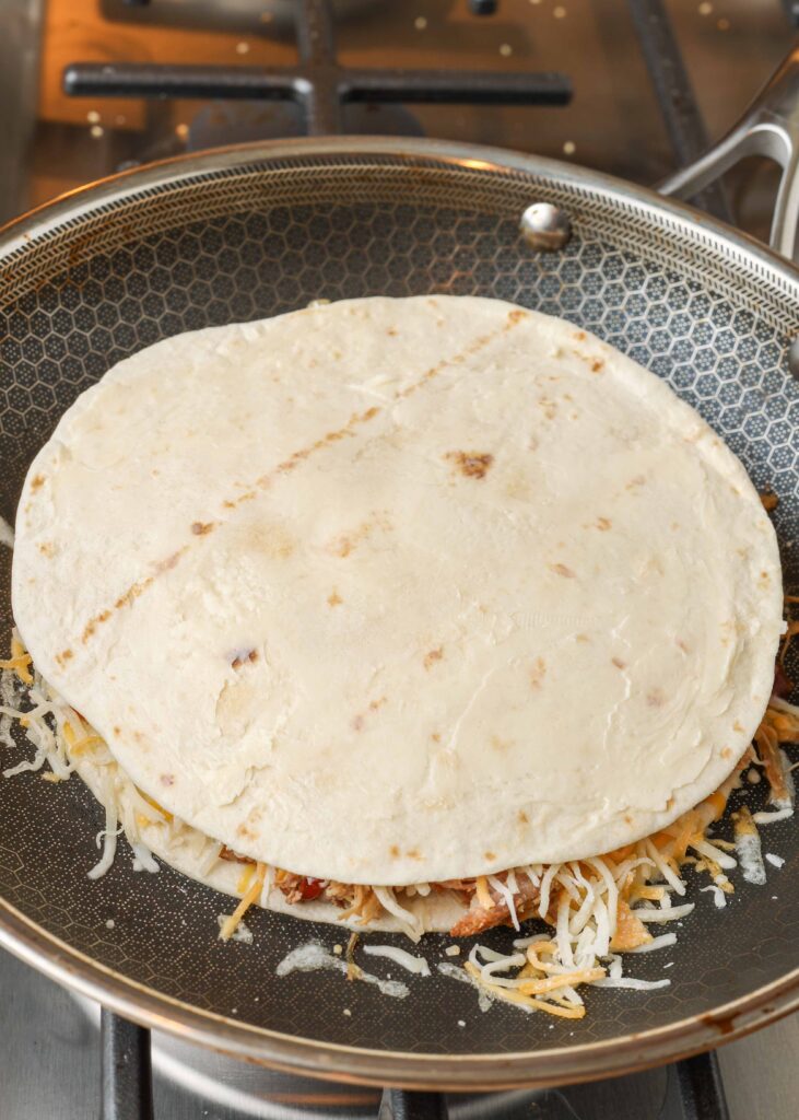 buttered quesadilla in skillet