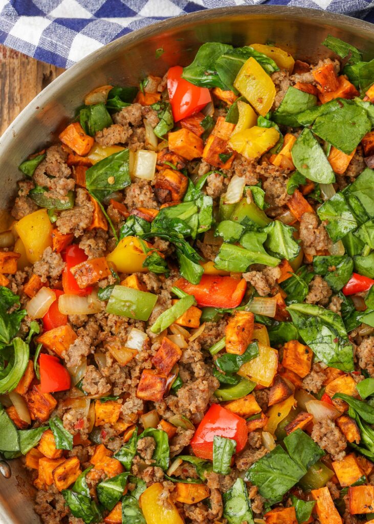 Breakfast skillet with sweet potatoes, peppers and sausage