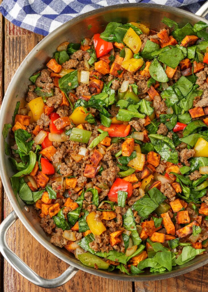 Breakfast skillet with sweet potatoes, peppers and sausage