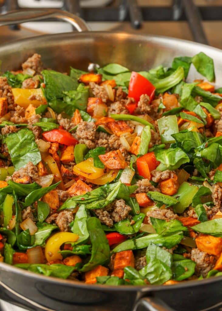 spinach hash with sausage, sweet potatoes, and bell peppers