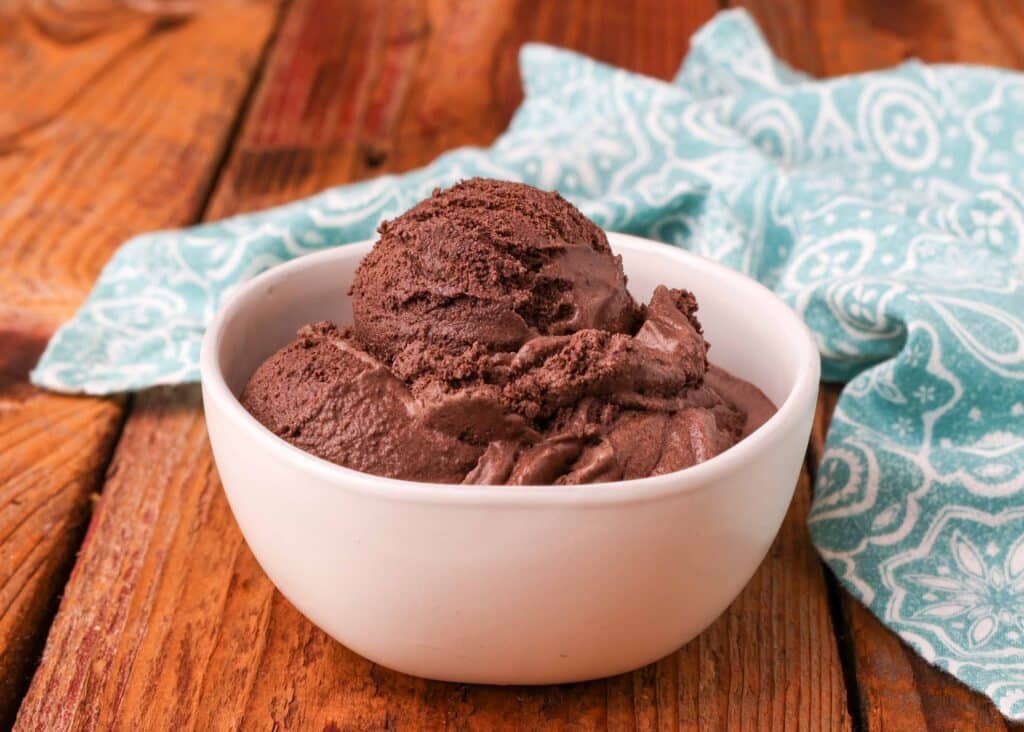 Dark Chocolate ice cream in white bowl with light blue and white linen