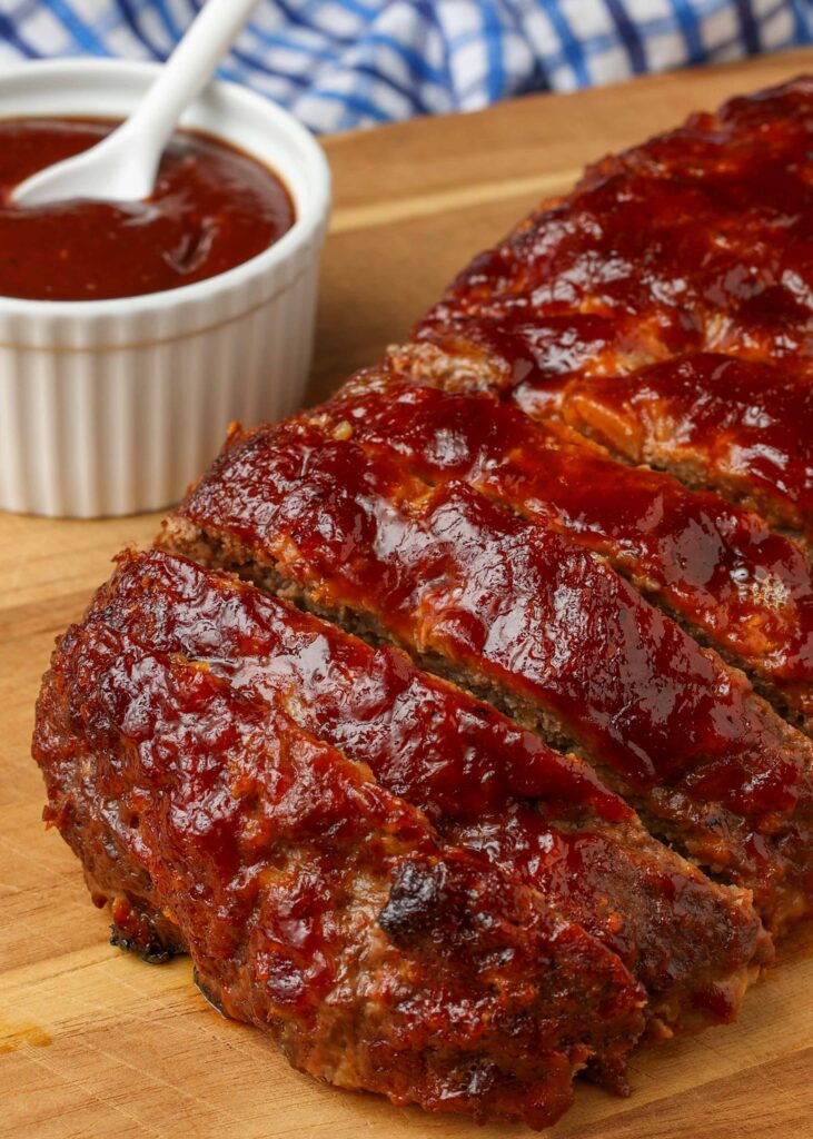 close up photo of meatloaf with bbq sauce and bacon
