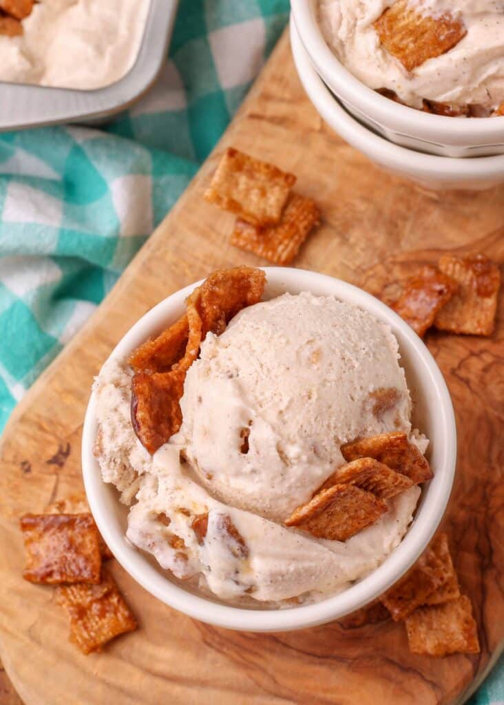 a bowl of Cinnamon Toast Crunch Ice Cream topped with chunks of granola