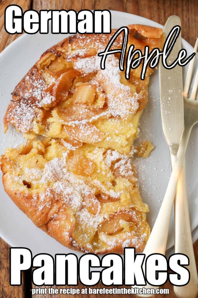 A top down photo of a white plate with sliced ​​apples and a portion of Dutch baby with powdered sugar, a knife and fork resting on the plate next to the food. White text is superimposed on the image and reads: "German apple pancake"