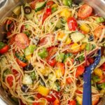 All of the ingredients have been mixed together, and this spaghetti salad is ready to serve!