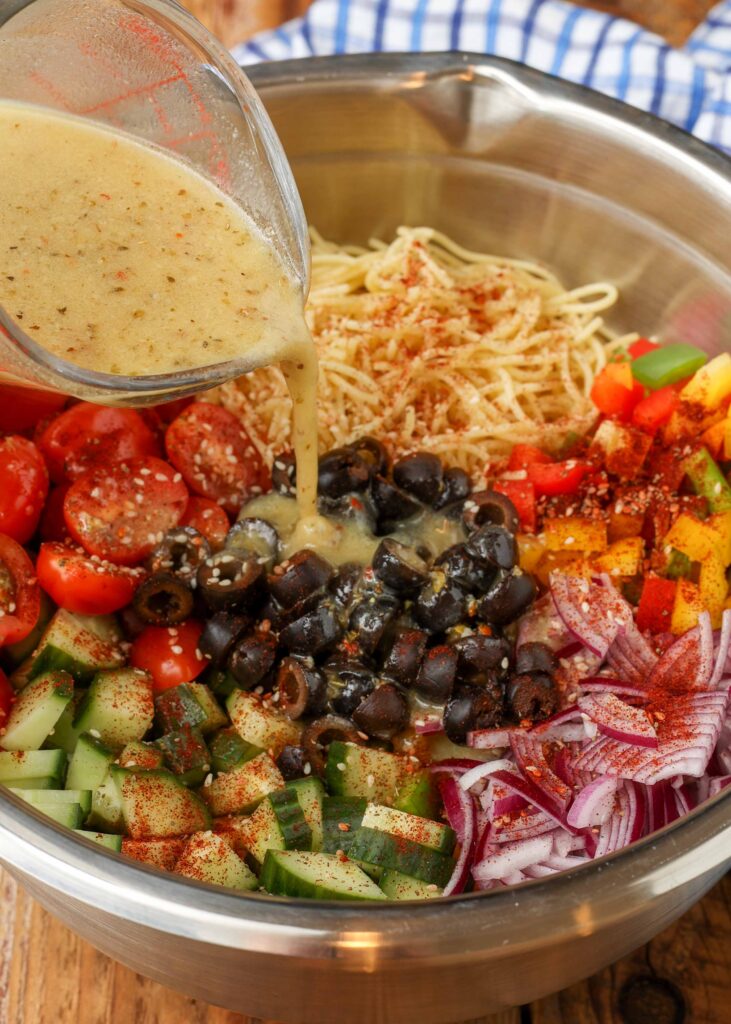 California spaghetti salad with remaining ingredients mixed with Italian dressing.