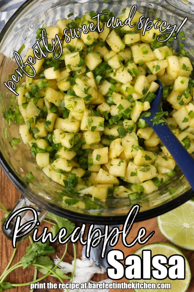fresh salsa with pineapple and jalapeno in clear bowl with striped blue towel