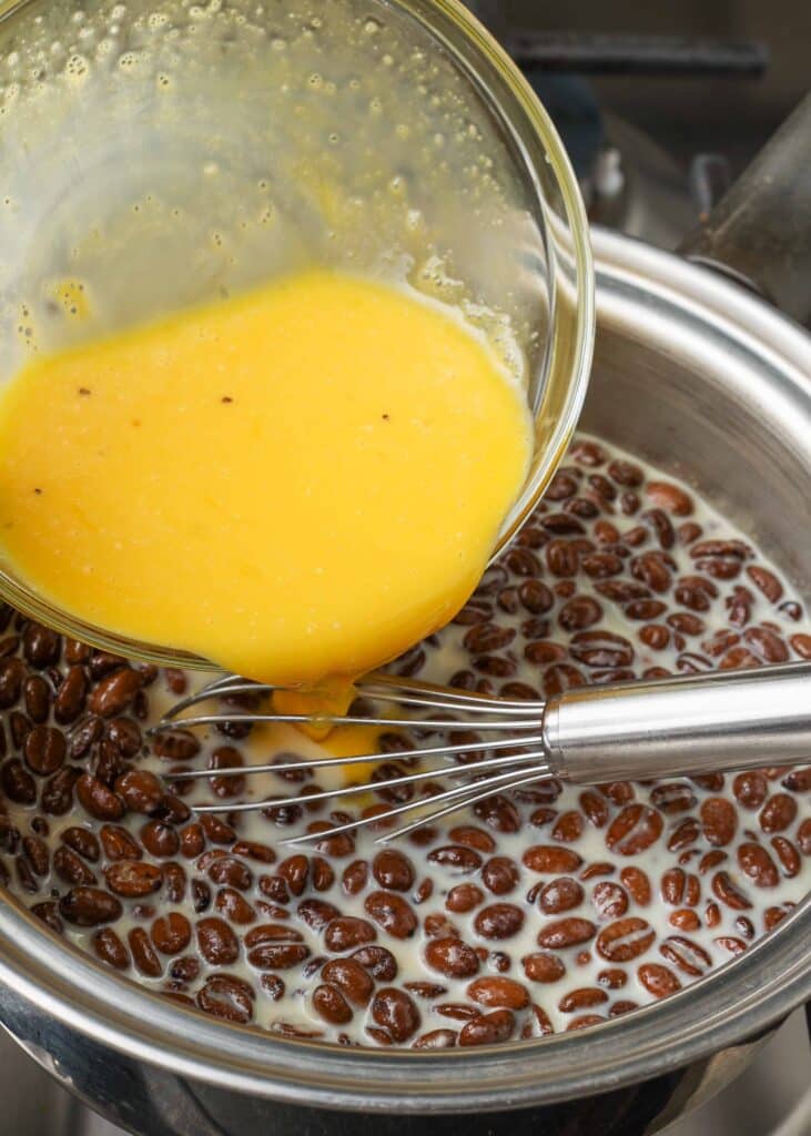 Adding egg mixture to coffee pan