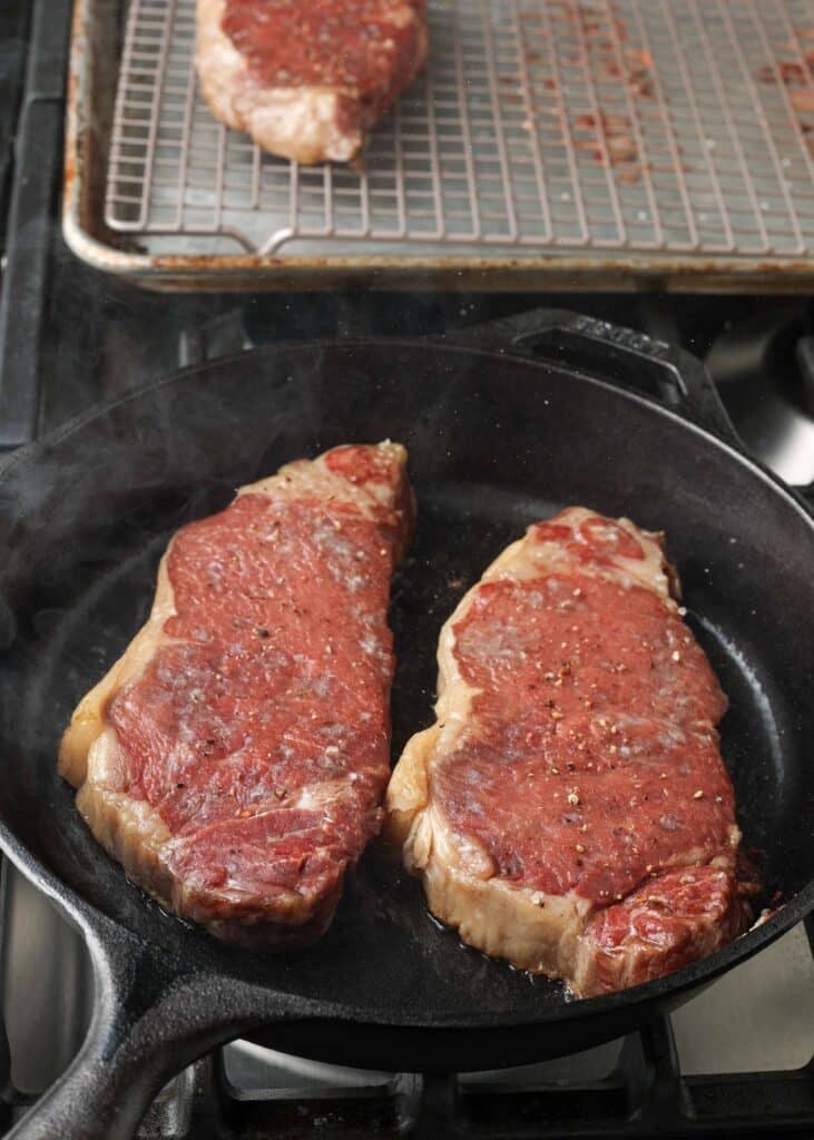 steaks in cast iron skillet