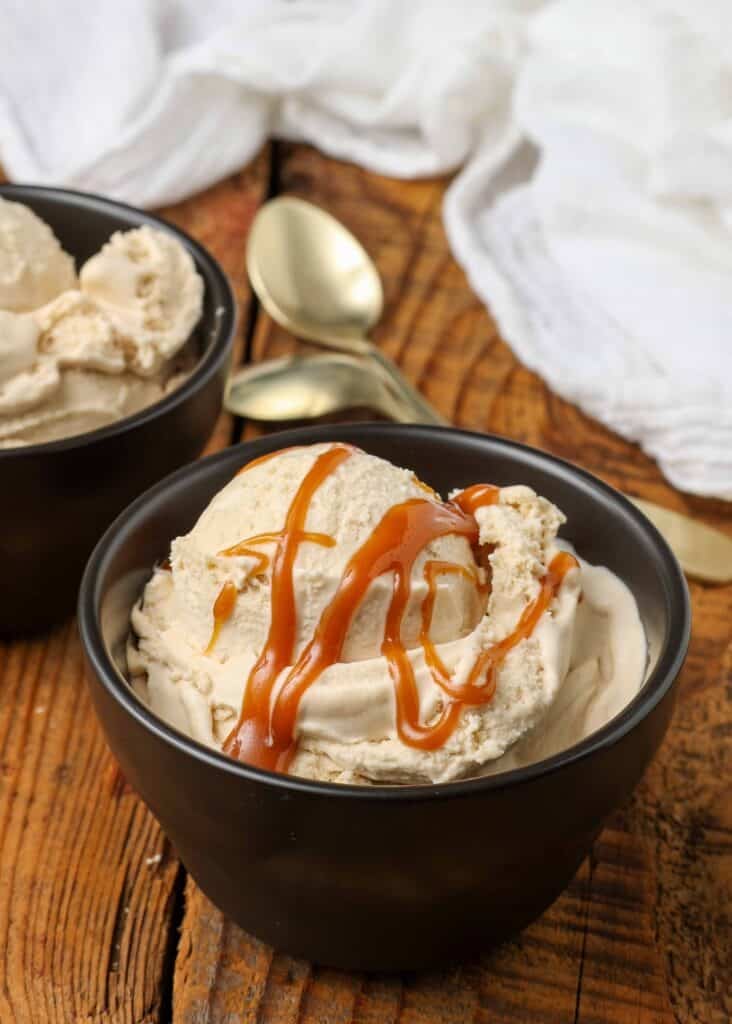 ice cream made with salted caramel in bowl on wooden table