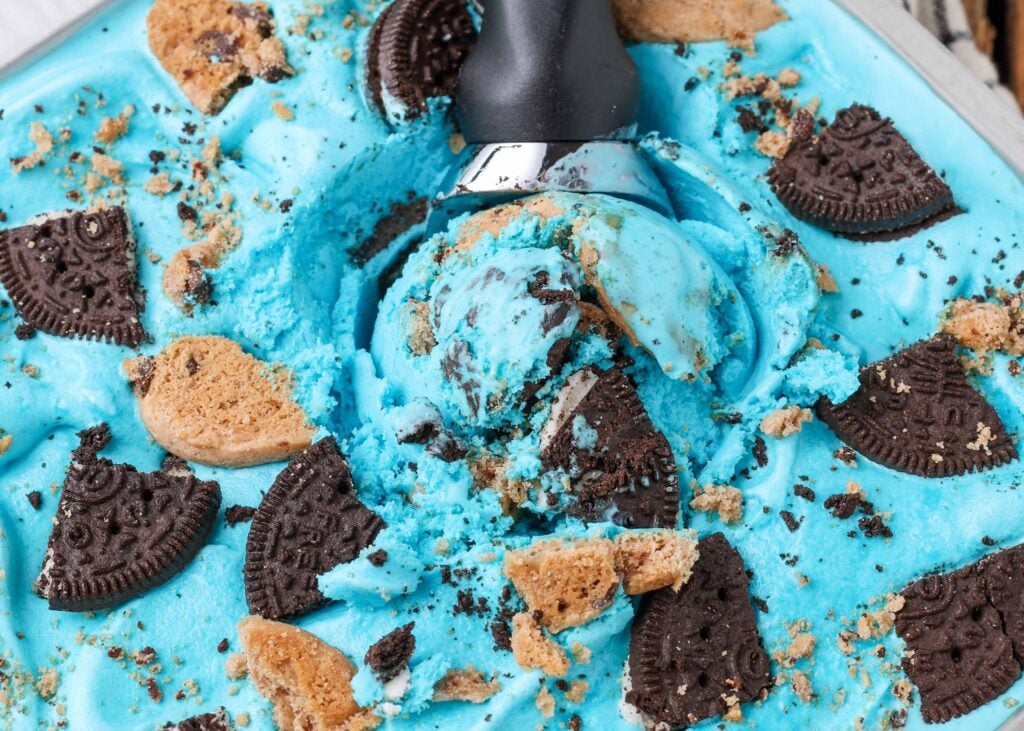 close up of blue ice cream with Oreos and chocolate chip cookie chunks