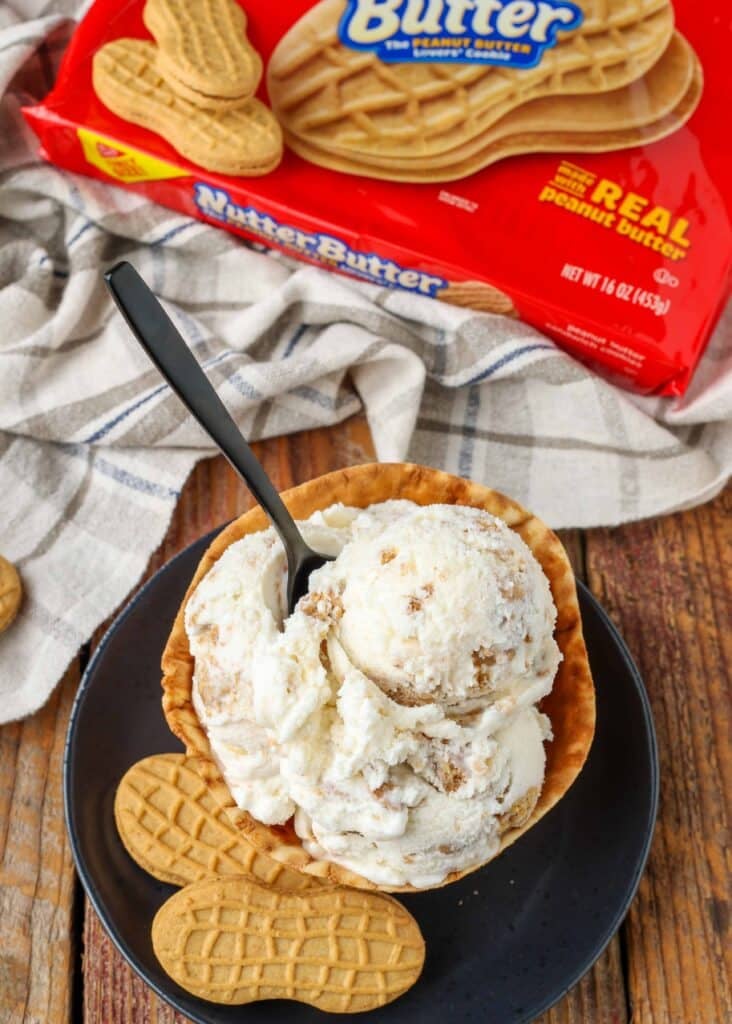 ice cream made with Nutter Butter cookies in bowl next to package of cookies