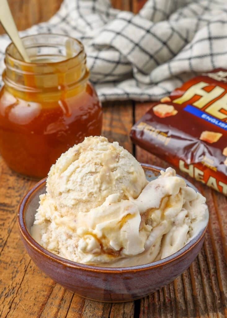vanilla ice cream with a jar of caramel sauce and a packet of caramel pieces